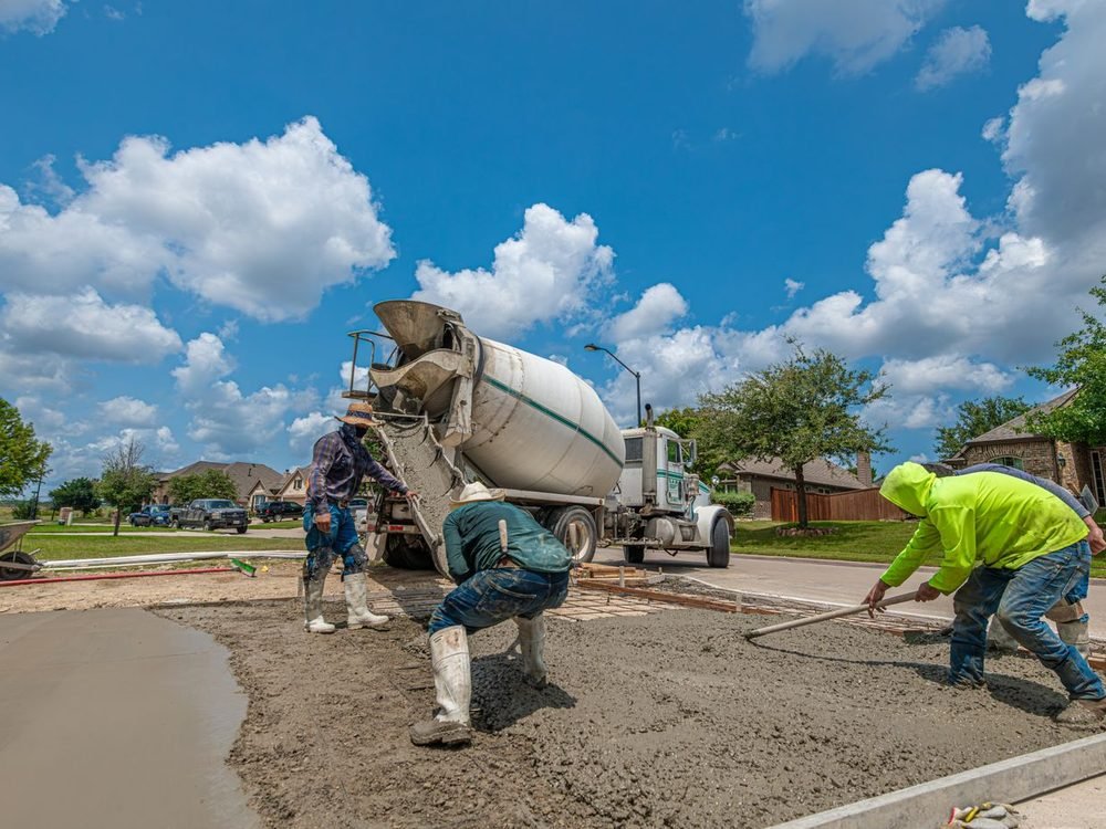 Crew pouring and finishing concrete
